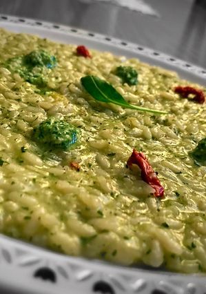 A picture of Risotto with Arugula Pesto and Sun-Dried Tomatoes.
