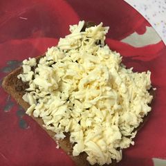 A picture of Nutella, honey, and cheese toast.