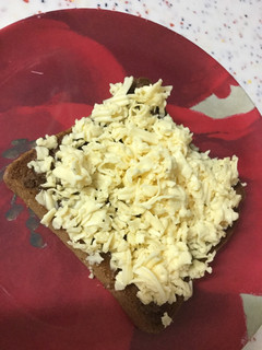 A picture of Nutella, honey, and cheese toast.