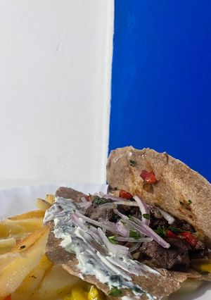 Una foto de Tacos o wrap integral y guarnición