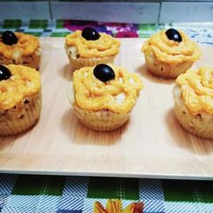 A picture of Orange black berry muffins.
