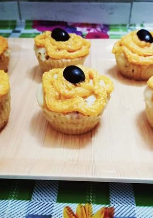 A picture of Orange black berry muffins.