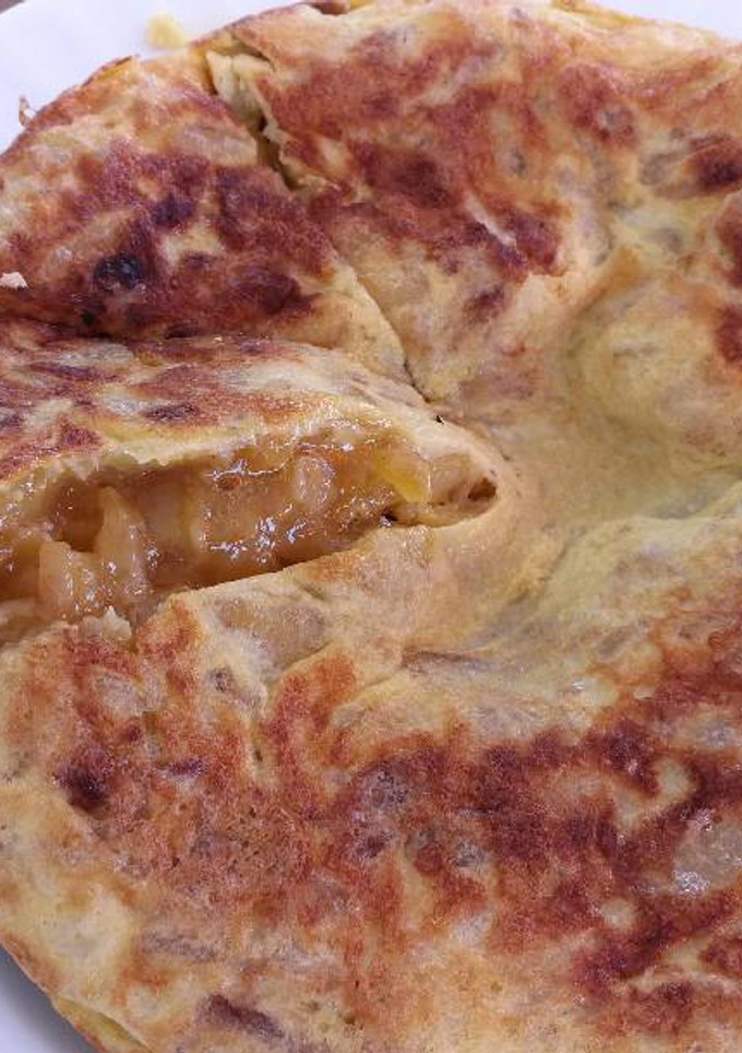 Una foto de Tortilla de Patatas & Cebolla