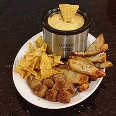 A picture of Potato Skin Dippers with Sausage Cheese Dip with Chips and Meatballs.