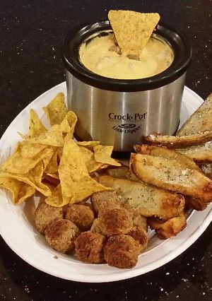 A picture of Potato Skin Dippers with Sausage Cheese Dip with Chips and Meatballs.