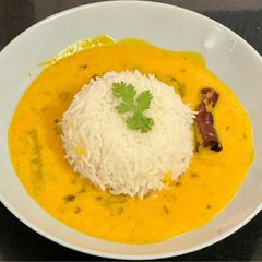 A picture of Alphanso Mango 🥭 Kadhi With Steamed Rice (Fajeto).