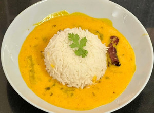 A picture of Alphanso Mango 🥭 Kadhi With Steamed Rice (Fajeto).