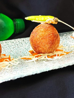 A picture of Dal chawal arancini.