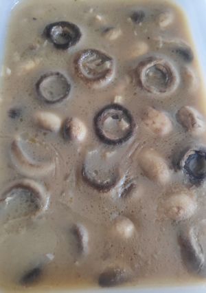 Una foto de Champiñones al vino blanco