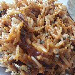 A picture of Chicken dum biryani in oven.