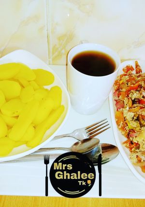 A picture of Boiled irish potatoes with sauce and black tea.