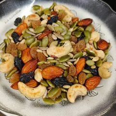 A picture of Masala Roasted Pumpkin Seeds and nuts.