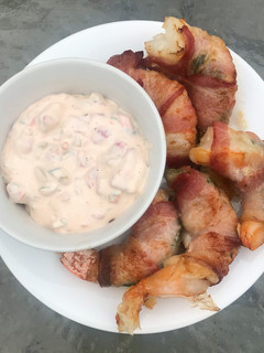 A picture of Bacon-Wrapped Stuffed Shrimp w/ Sauce.