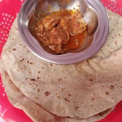 A picture of Roti with chicken salan.