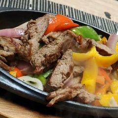 A picture of Stir fry shredded meat and vegetables.
