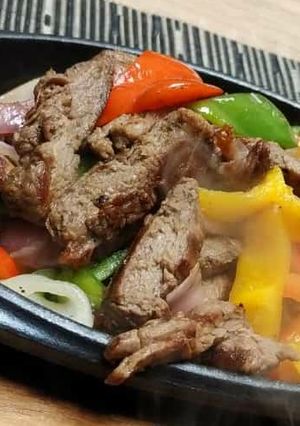 A picture of Stir fry shredded meat and vegetables.