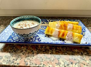 Foto di Spiedini d’ananas grigliati con salsa cocco e rum