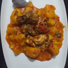 A picture of Yam porriage with smoked fish.