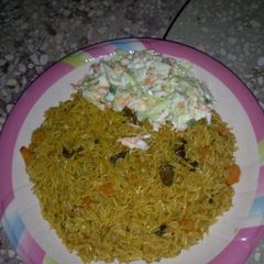 A picture of Basmati jollof with coleslaw.