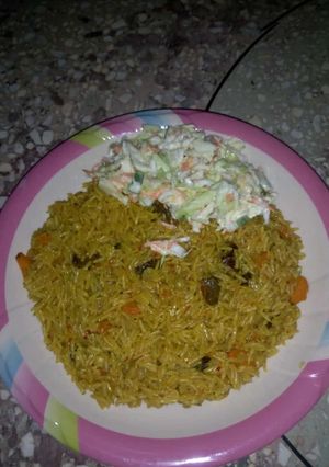 A picture of Basmati jollof with coleslaw.