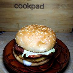 A picture of Double patty burger with Hung curd sauce.