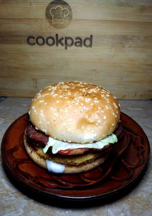 A picture of Double patty burger with Hung curd sauce.