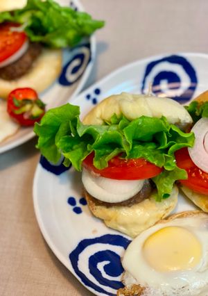 A picture of Beef Burger with Cheese and Dried Tomato Bread.