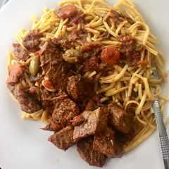 A picture of Spaghetti and beef stew.