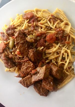 A picture of Spaghetti and beef stew.