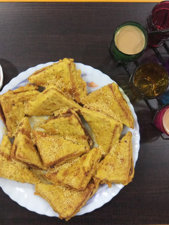 A picture of Cutting chai & bread pakoda with left over sabji.