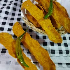 A picture of Fafda with fried mirchi.