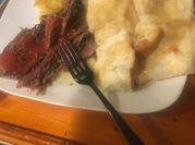 A picture of roast beef red wine