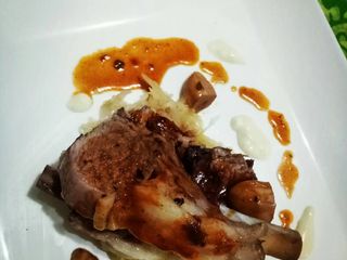 Roasted lamb rack with red wine reduc. And cream cheese melt