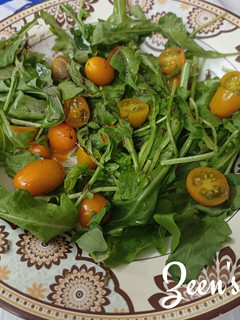 A picture of Arugula and Yellow Cherry Tomato Salad.