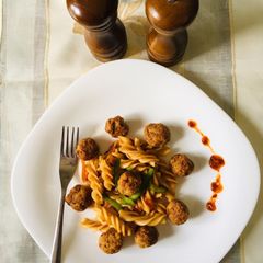 Creamy Pasta in Fajita Seasoning with Dry Chicken Manchurian A picture of Creamy Pasta in Fajita Seasoning with Dry Chicken Manchurian.