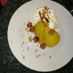 A picture of Pears poached in white wine .