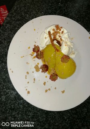 A picture of Pears poached in white wine .