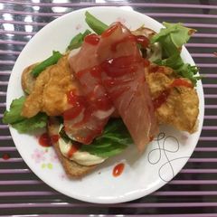 A picture of Fried Egg And Prosciutto Breakfast Sandwich.