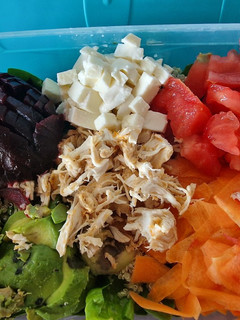 Una foto de Ensalada de quinoa y espinacas take away