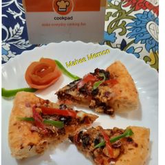 A picture of Chicken tandoori pizza.