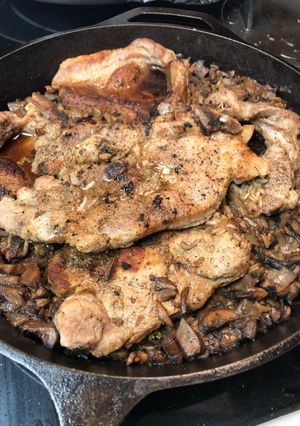 A picture of Baked pork chops and rice.