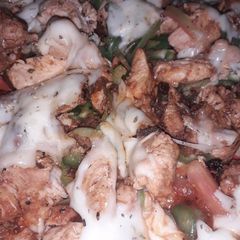 A picture of Chicken tikka pizza burst.
