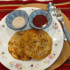 A picture of Vegetable pancakes with idli batter.
