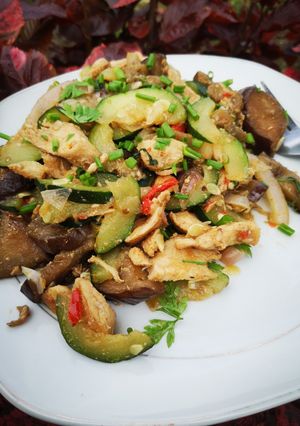 A picture of Zucchini and eggplant stir fry.