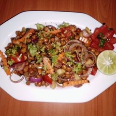 A picture of Black chickpeas 🥗 salad 🍅🧅🥕🥒.