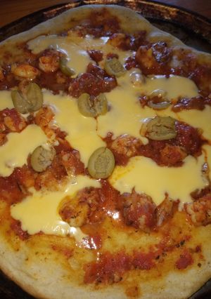 Una foto de Pizza con langostinos