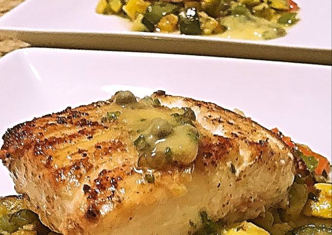 Wild halibut with lemon honey butter caper sauce and succotash