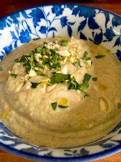 A picture of Almendras Soup with spiced almonds and cauliflower.