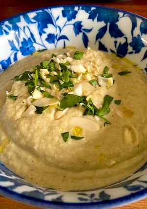A picture of Almendras Soup with spiced almonds and cauliflower.