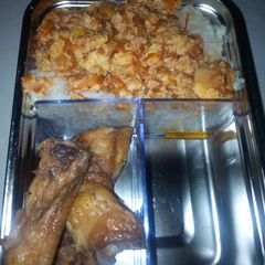 A picture of Rice and egg source with chicken.